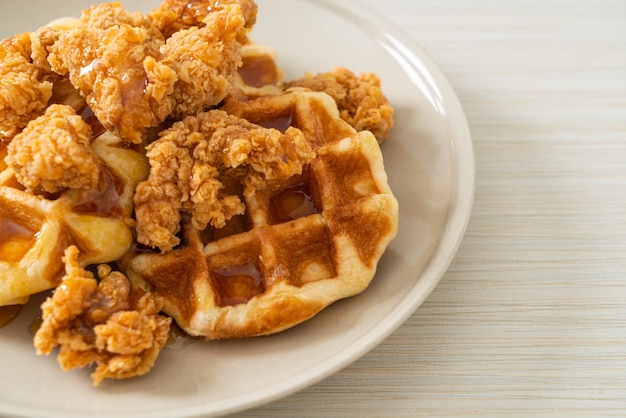 homemade fried chicken waffle with honey or maple syrup