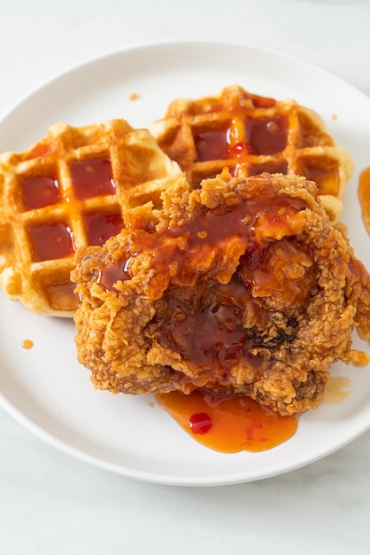 homemade fried chicken with waffle and spicy sauce