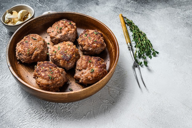 Homemade fried cutlets from beef and pork meat. White background. Top view. Copy space.