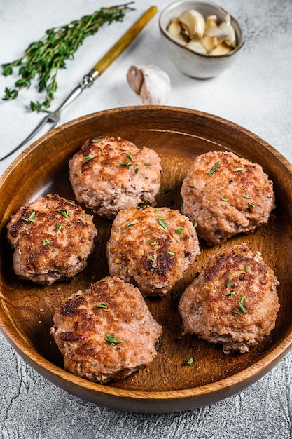 Homemade fried cutlets from beef and pork meat