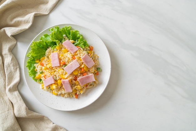 homemade fried rice with ham and mixed vegetable (carrot, green bean peas, carrot)