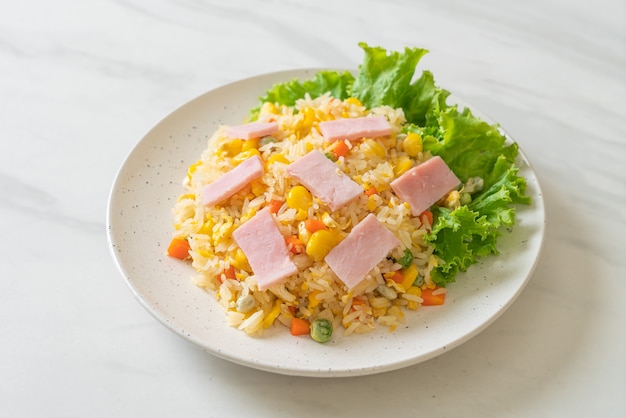 homemade fried rice with ham and mixed vegetable (carrot, green bean peas, carrot)
