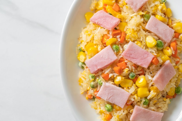 homemade fried rice with ham and mixed vegetable (carrot, green bean peas, carrot)