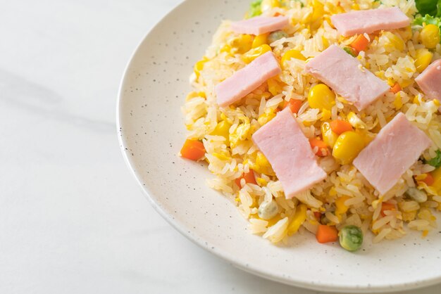 homemade fried rice with ham and mixed vegetable (carrot, green bean peas, carrot)