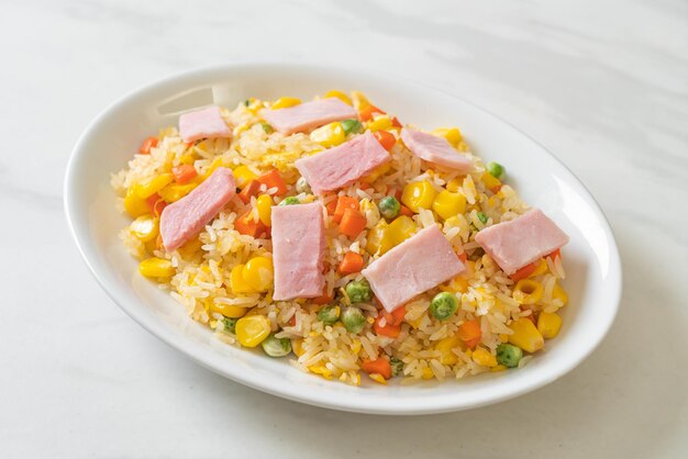 homemade fried rice with ham and mixed vegetable (carrot, green bean peas, carrot)