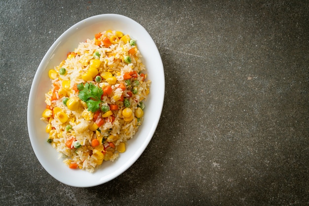 homemade fried rice with mixed vegetable (carrot, green bean peas, corn) and egg