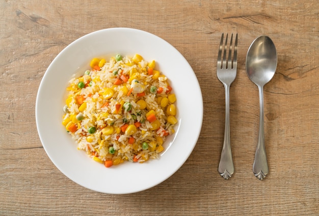 homemade fried rice with mixed vegetable (carrot, green bean peas, corn) and egg