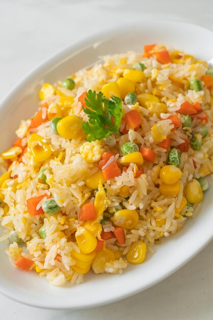 homemade fried rice with mixed vegetable (carrot, green bean peas, corn) and egg