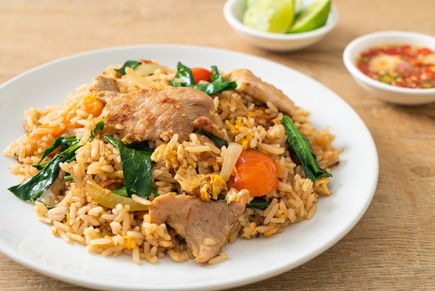 Homemade fried rice with pork on white plate