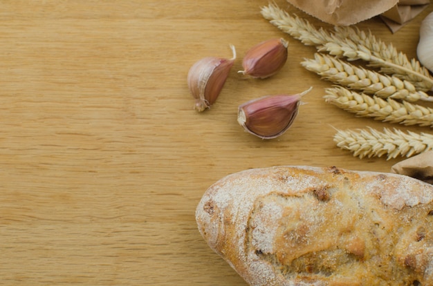 Homemade garlic nut bread on a dark wooden background