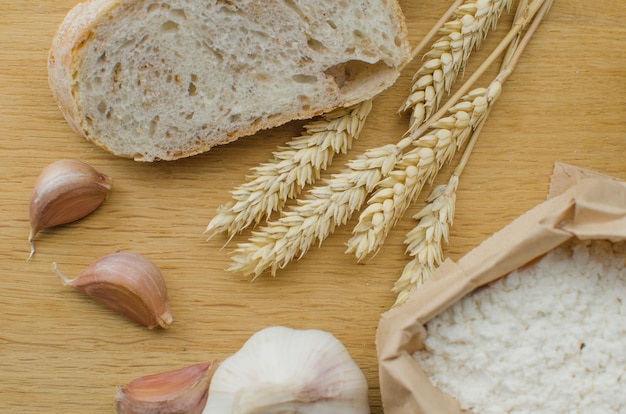 Homemade garlic nut bread on a dark wooden background