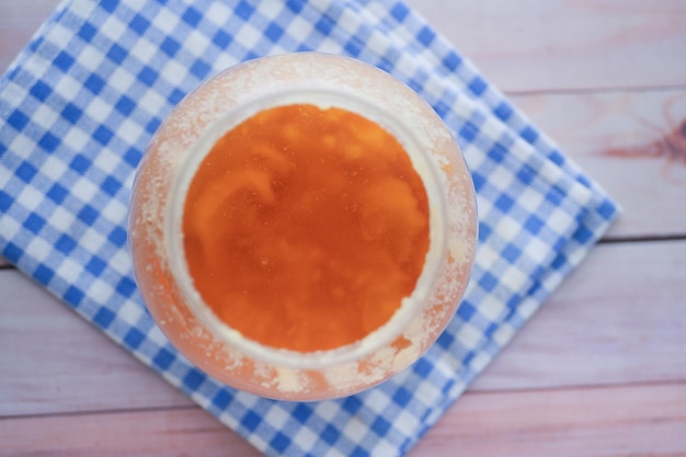 Homemade ghee in container on a table