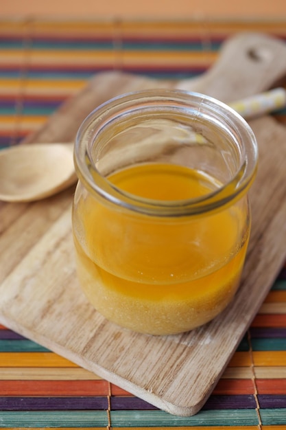 Homemade ghee in container on a table