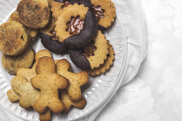 Homemade gingerbread cinnamon and chocolate cookies on white