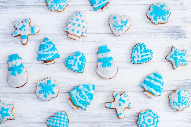 Homemade gingerbread cookies. Christmas gingerbread with white and blue glaze.