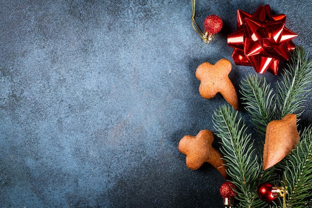 Homemade gingerbread cookies on dark background Christmas composition new year background Christmas dessert New Year flatlay