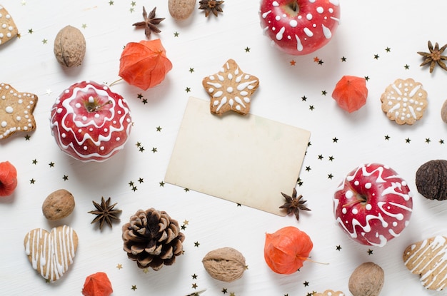 homemade gingerbread cookies, painted apple. trendy christmas, new year template.