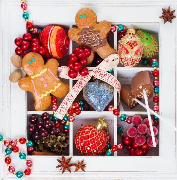 Homemade gingerbread men with colorful christmas decorations