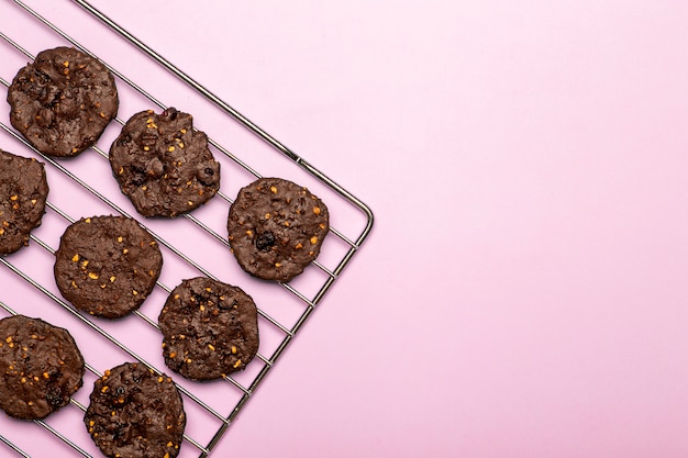 Homemade gluten-free chocolate chip cookies with cereals, nuts and organic cocoa. Cookies and pastries from rye flour on a colored background. Gluten free concept