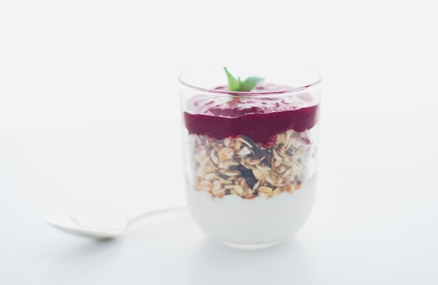 Homemade granola parfait with berry jam and mint yogurt and muesli cereal as healthy breakfast food in the morning organic dairy yoghurt for diet nutrition brand