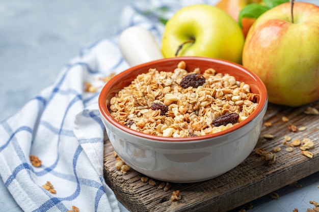 Photo homemade granola with apples and raisins