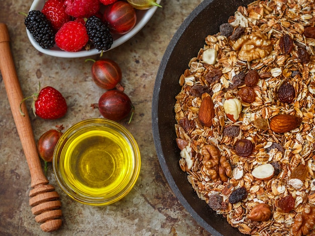 Homemade granola with raisins, walnuts, almonds and hazelnuts. Muesli and honey 