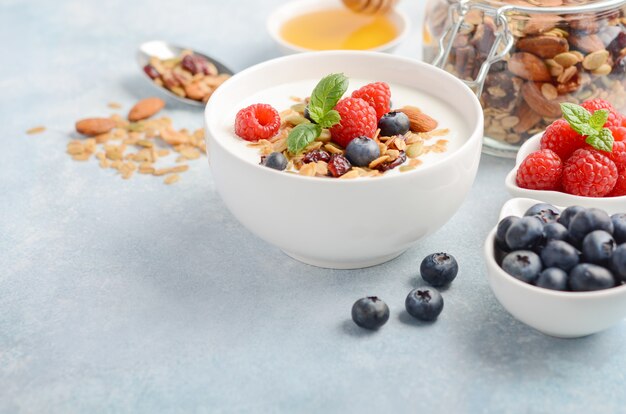 Homemade granola with yogurt and fresh berries