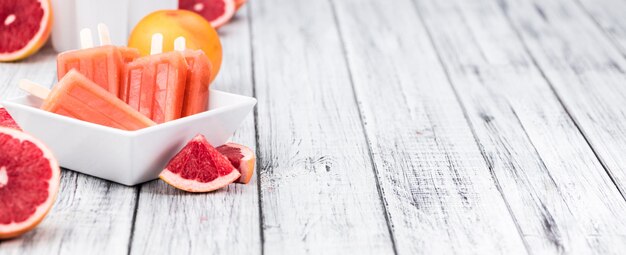 Homemade Grapefruit Popsicles selective focus