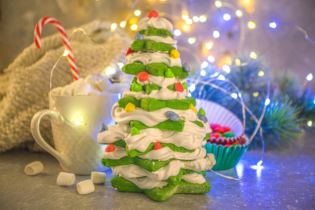 Homemade green gingerbread, meringue dessert Christmas tree 