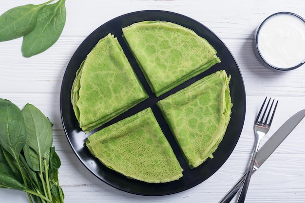 Homemade green pancakes with spinach healthy crapes