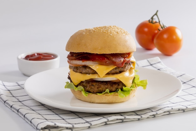 Homemade grilled cheese burger with lettuce on wooden board