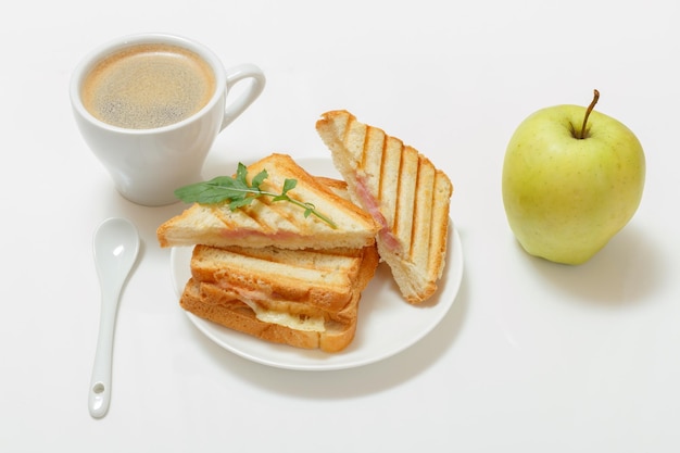 Homemade grilled cheese sandwich for breakfast with cup of coffee