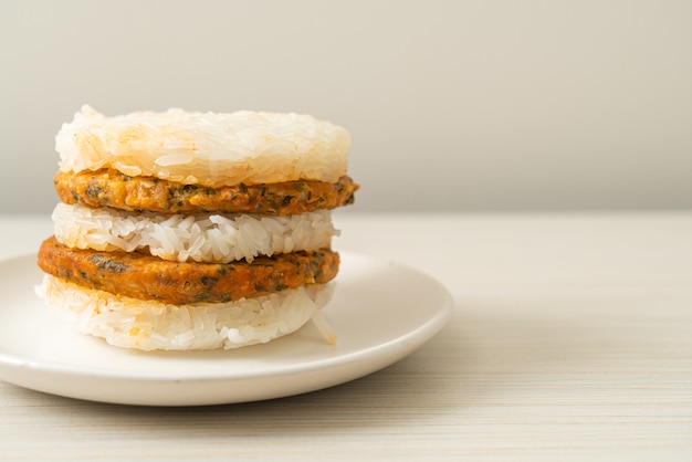 homemade grilled spicy pork and herbs with  sticky rice burger