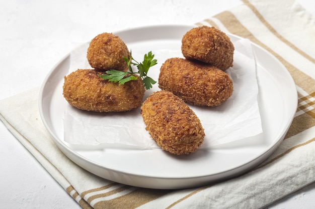 Photo homemade ham croquettes. typical spanish food