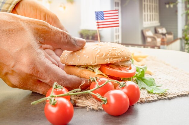 The homemade hamburger with fresh vegetables french fries beef onion tomato