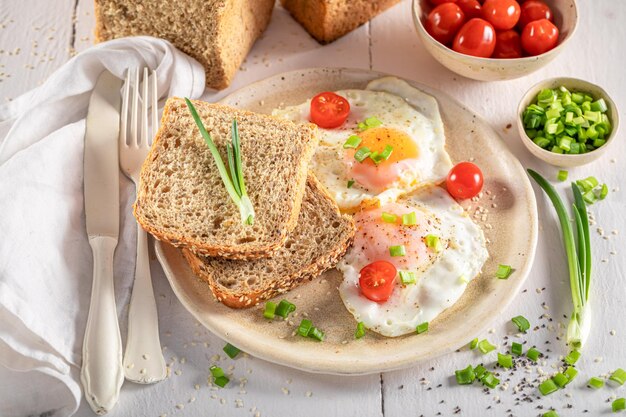 Homemade and healthy breakfast with bread and fried eggs