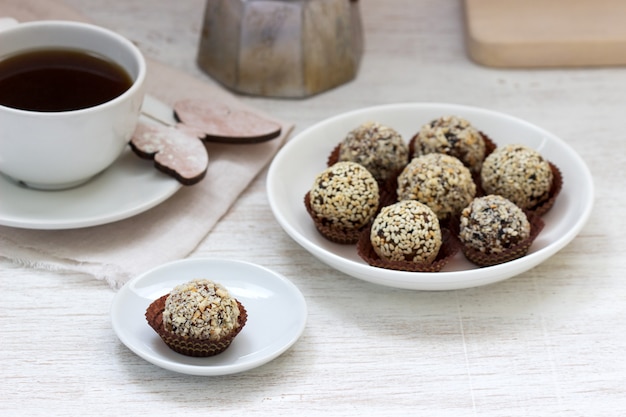 Homemade healthy candy made from dried fruits, honey and nuts. Rustic style.