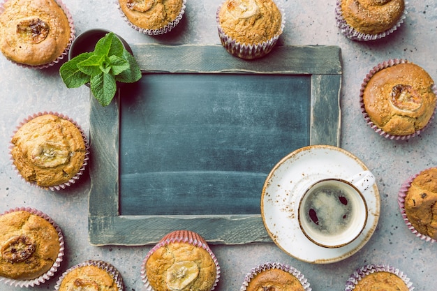 Homemade healthy out banana muffins on gray stone surface, top view