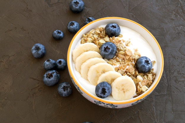 Homemade healthy yogurt with muesli and blueberries.