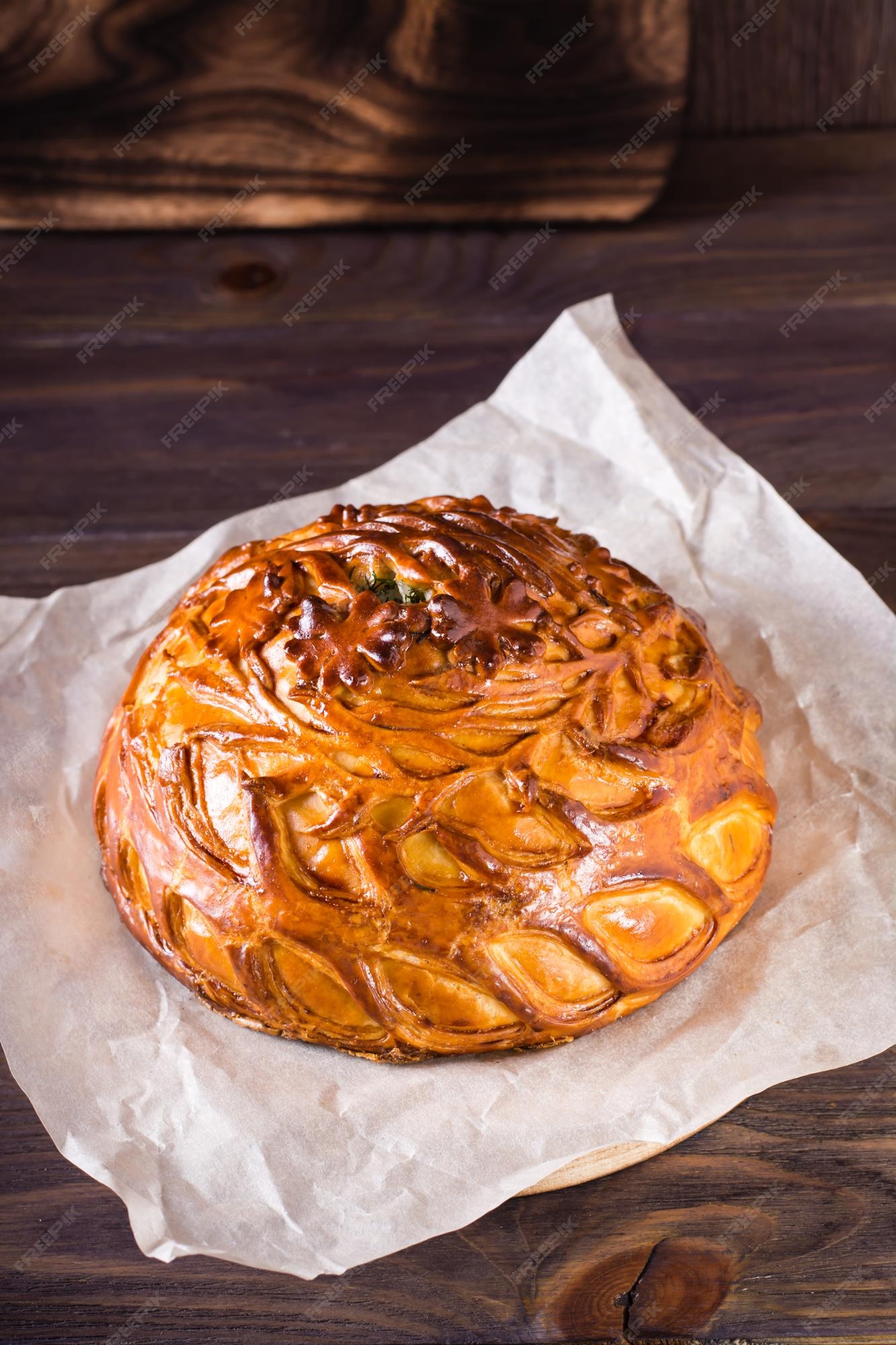 Premium Photo  Homemade hearty kurnik pie with chicken potatoes and rice  on parchment vertical view