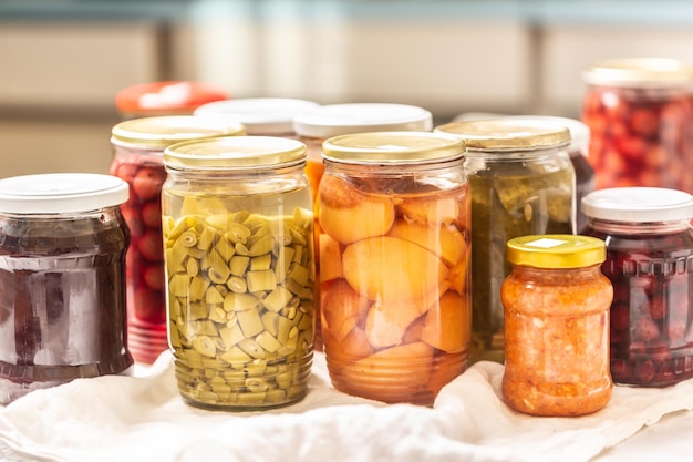 Homemade and homegrown fruit and vegetable preserves in jars