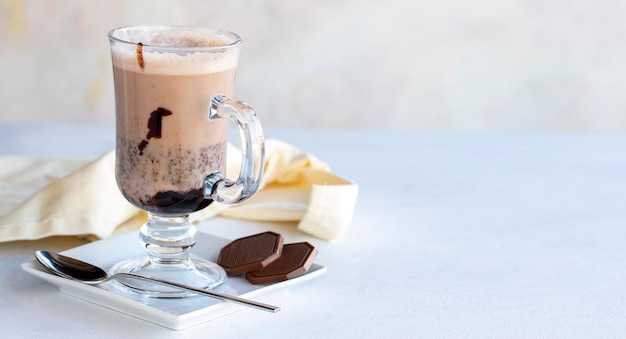 Homemade hot chocolate drink on a white background close up