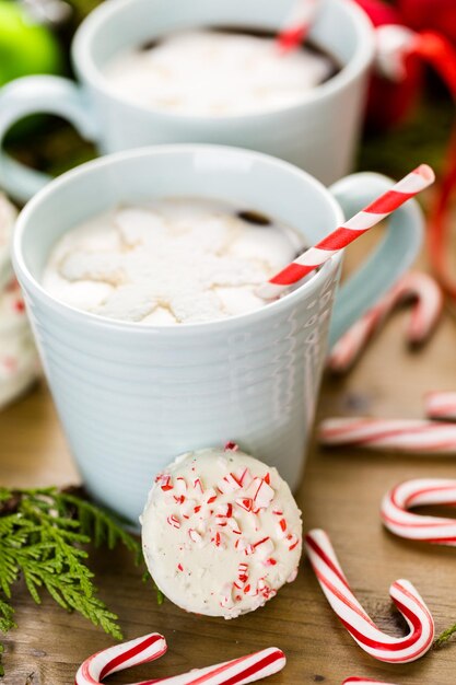 Homemade hot chocolate garnished with snowflake shaped white marshmallows.