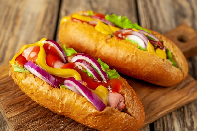 homemade hot dogs on wood background