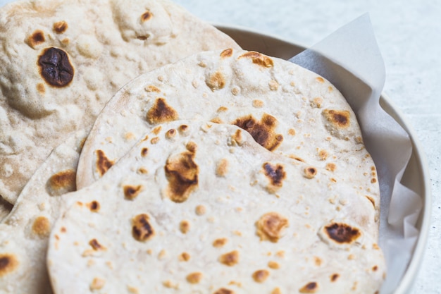 Homemade indian flatbread chapati on gray