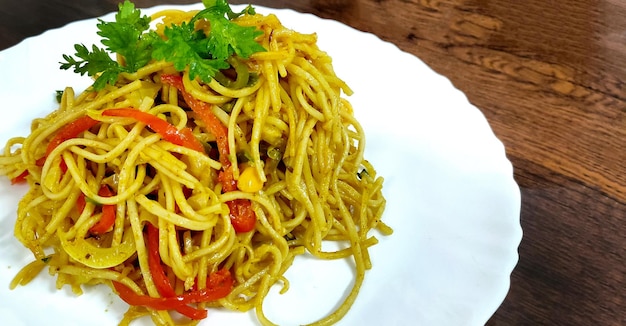 Homemade IndoChinese recipe Schezwan Noodles or vegetable Hakka Noodles or chow mein selective focus