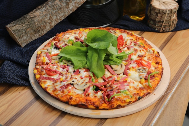 Homemade Italian pizza with mozzarella cheese salami tomato sauce pepper arugula and spices