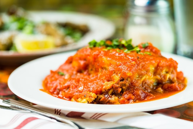 Homemade Lasagna on the table in Italian restaurant.