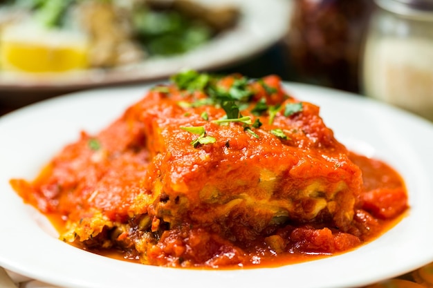 Homemade Lasagna on the table in Italian restaurant.