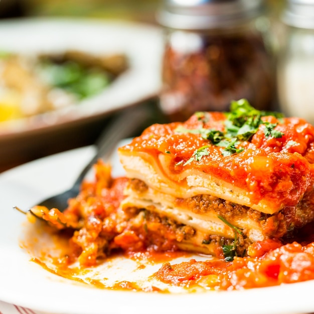 Homemade lasagna on the table in italian restaurant